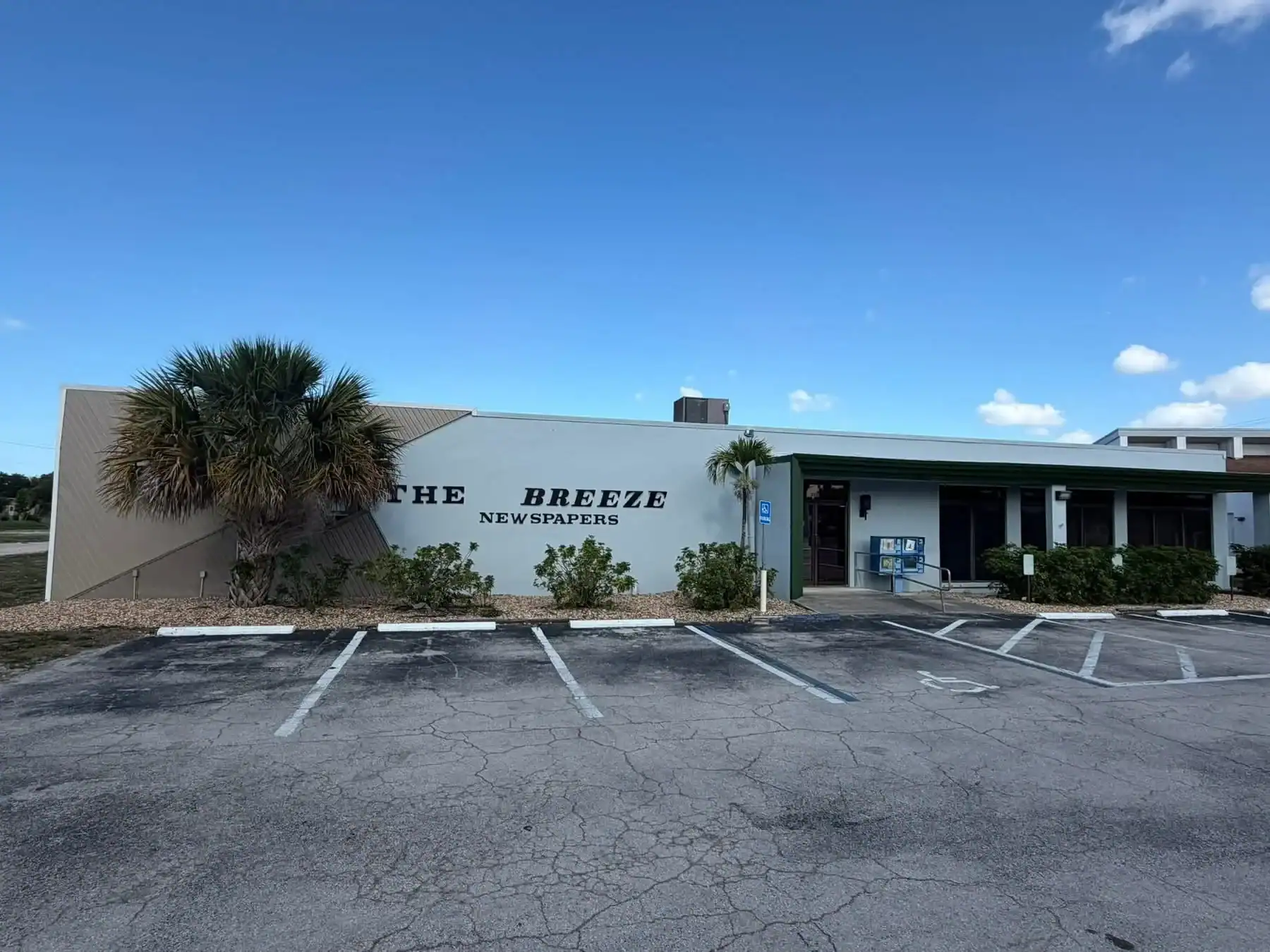 Commercial Building Exterior Painting in Southwest Florida The exterior of 'THE BREEZE NEWSPAPERS' commercial building, recently painted in Southwest Florida.
